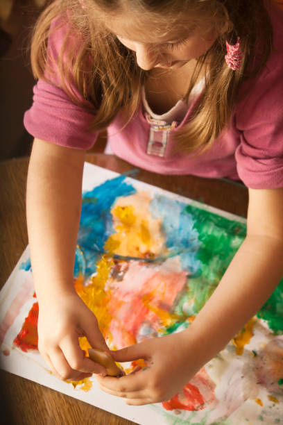 istock Little Girl is Painting 155141458