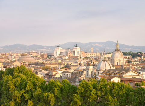 High angle view of Rome's ancient skyline in soft evening light.