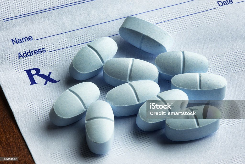 Hydrocodone with Acetaminophen Tablets on a Prescription Form  Opioid Stock Photo