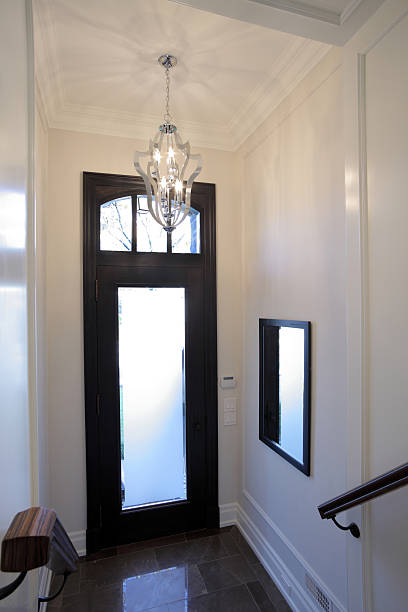 Brand New North American Home Hallway of new custom North American Home. looking out front door stock pictures, royalty-free photos & images