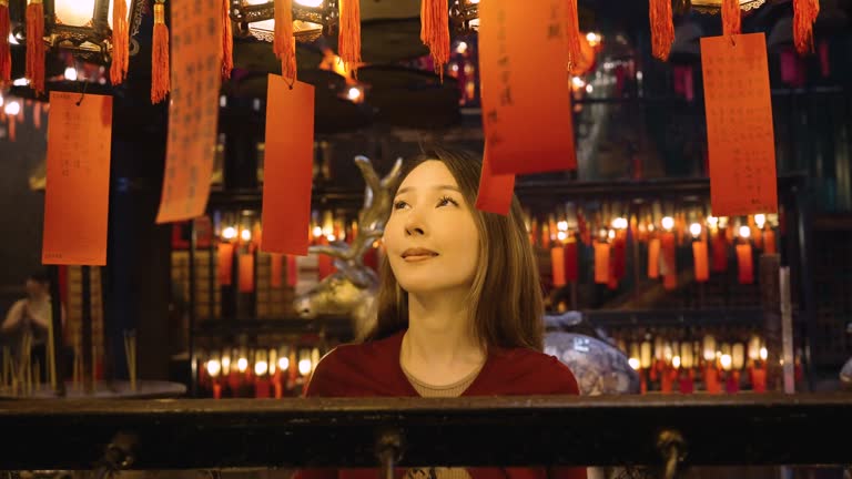 Asian woman traveling at Man Mo temple in Hong Kong