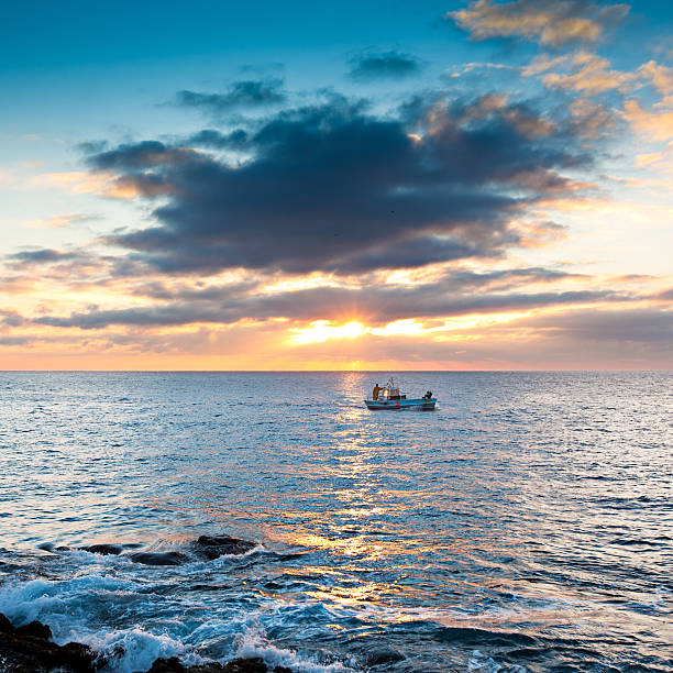 Fisherman in a morning sunrise in Cap de Creus - Costa Brava - Catalunya - Spain