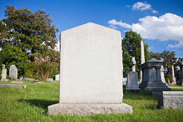 Blank Tombstone A Blank Tombstone On A Sunny Day tombstone stock pictures, royalty-free photos & images