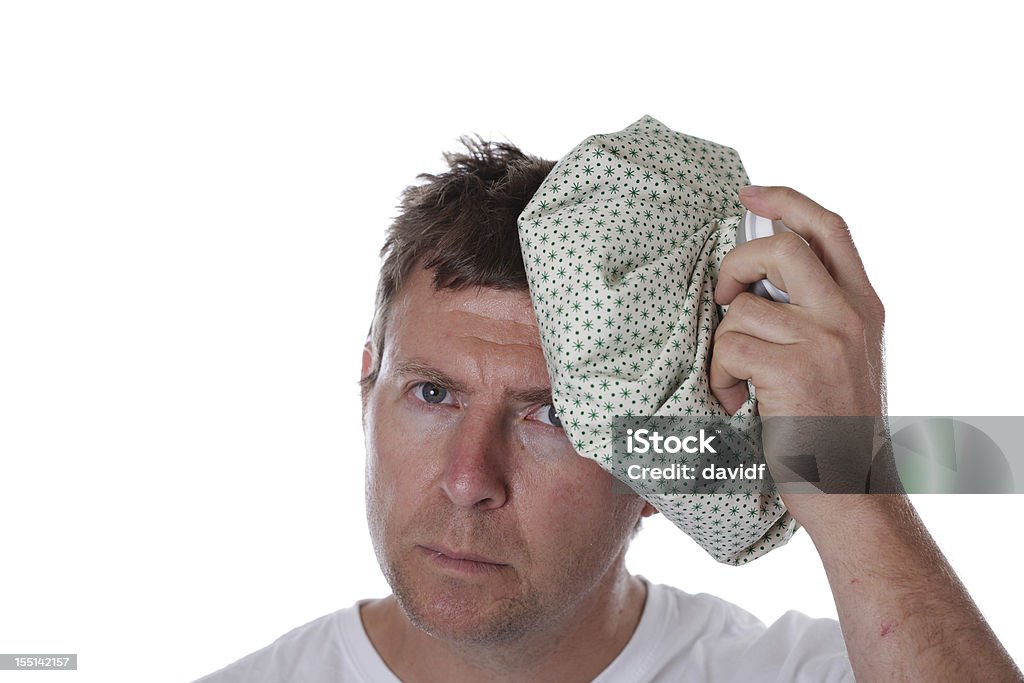 Sick Man Sick man with an old fashioned ice pack for a headache or fever Adult Stock Photo