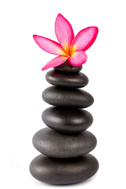 istock Lastones with frangipani flower isolated on white 155142325