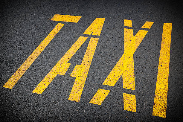 Yellow squares on the pavement indicate a taxi stand.