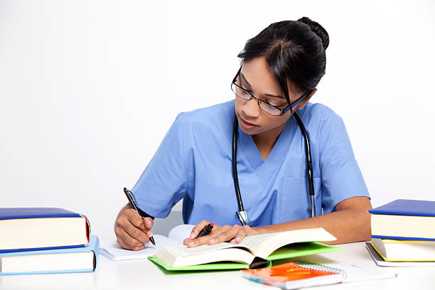 Medical nurse studying for her exams stock photo