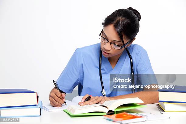 Medical Nurse Studying For Her Exams Stock Photo - Download Image Now - Nurse, Learning, Studying