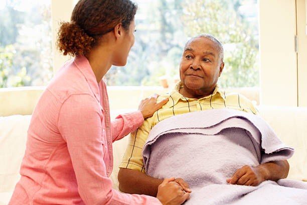 Daughter tending to her sick father