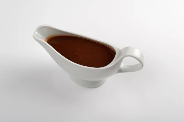 istock White china gravy boat isolated on white background. 155142771