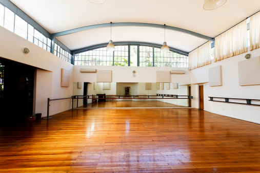Light, lofty dance studio with polished wooden floors and ballet barres fixed to the wall just needs the dancers to bring it to life. 