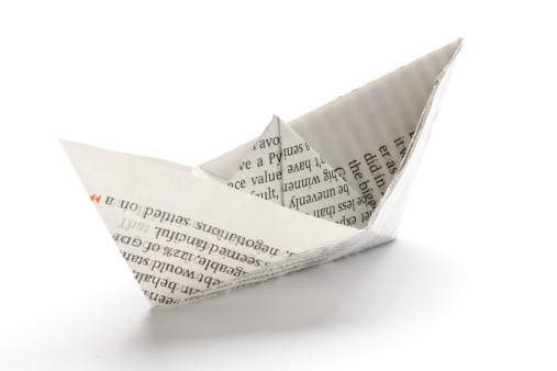 Paper ship on white background. 