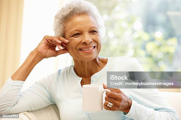 Senior African American Woman Holding A Mug At Home Stock Photo - Download Image Now