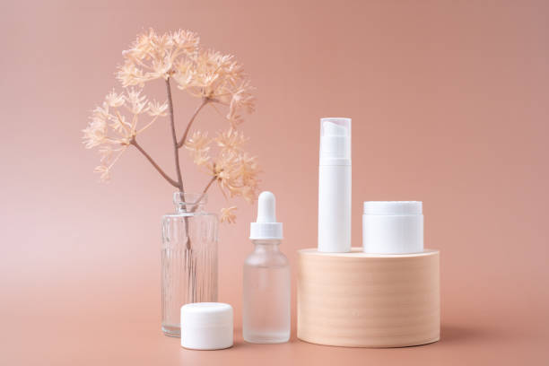 istock Cosmetic, packaging, mock up on pastel background includes serum, dropper, jar, and pump bottle. 1551430832