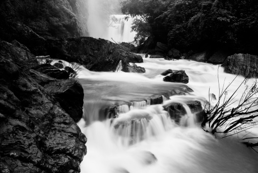 A grayscale shot of a beautiful mountainous landscape