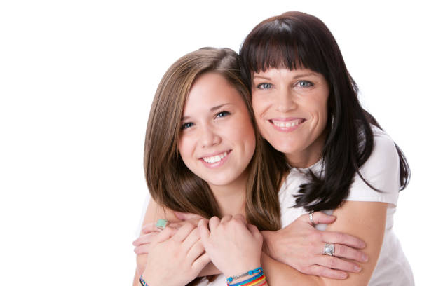 Happy family resting at beach in summer. Mother and daughter together on the beach chair.