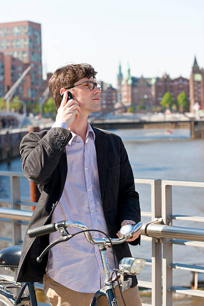 Man with cell phone in Hamburg  ausschau halten stock pictures, royalty-free photos & images