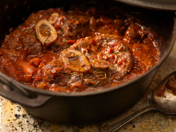 Hole Bone Osso Buco a Classic Italian Dish with Braised Veal Shanks, Stewed Tomatoes, Onions, Carrots, Celery and Fresh Herbs- Photographed on Hasselblad H3D2-39mb Camera ossobuco stock pictures, royalty-free photos & images