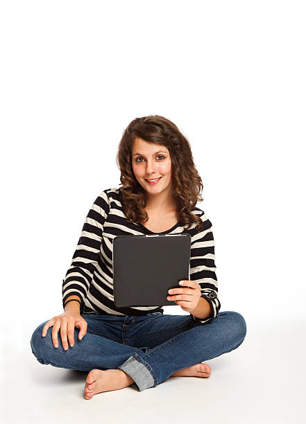 istock teenager with her touch screen tablet 155143586