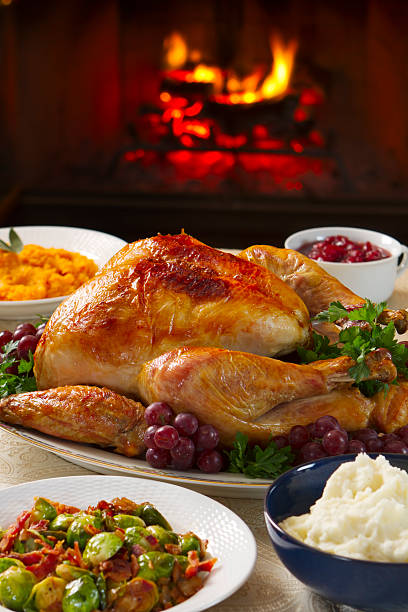 istock Cooked turkey on a dish with grapes in front of open fire 155143865