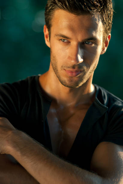 Attractive male model Portrait of beautiful male model smiling with crossed arms. hot handsome man stock pictures, royalty-free photos & images