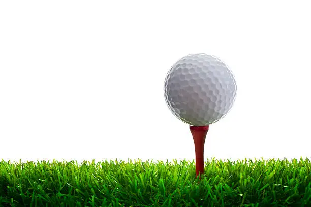Photo of Golf Ball and Tee on grass