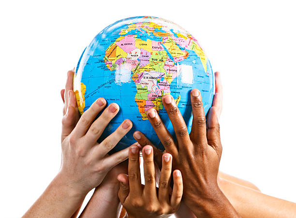 istock Many mixed hands support Mother Earth with Africa topmost 155144280