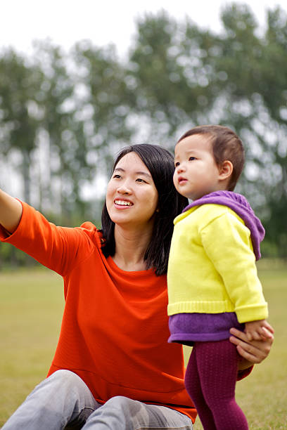 istock Cute baby playing with mother 155144293