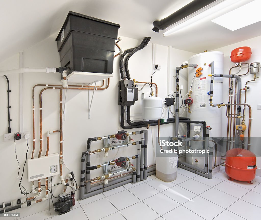 Central Heating Control System an elaborate and immaculately installed central heating control system in an expensive new house. This system represents an advanced energy efficient heating installation. Radiator - Heater Stock Photo