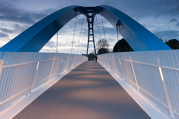 Modern pedestrian bridge over the M5 motorway Redhayes pedestrian bridge recently opened over the M5 motorway to allow access to new developments on the eastern outskirts of Exeter. exeter england stock pictures, royalty-free photos & images