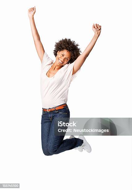 Donna Saltando In Celebrazione - Fotografie stock e altre immagini di Donne - Donne, Solo una donna, Saltare