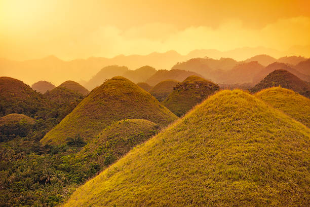 Chocolate hills Misty sunlight over Chocolate hills in Bohol, Philippines. chocolate hills photos stock pictures, royalty-free photos & images
