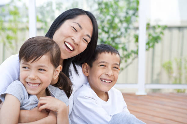 istock Mother and children sitting on deck 155145290
