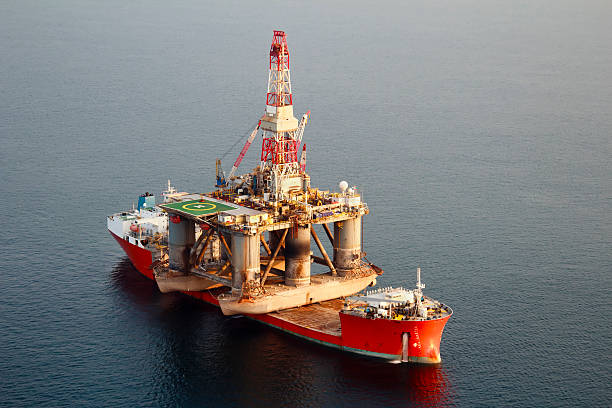 istock Heavy Lift Vessel and Oil Rig 155145533
