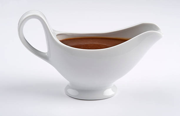 istock White china gravy boat on white background 155145878
