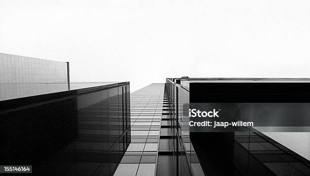 Looking Up At A Glass Skyscraper Stock Photo - Download Image Now - Black And White, Architecture, Building Exterior