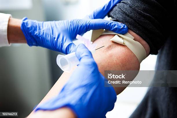 Nurse Drawing Blood Stock Photo - Download Image Now - Blood Donation, Blood Test, Tourniquet