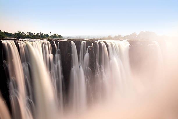 Romantic view of Victoria Falls Long exposure of the falls taken from the Zimbabwe side landscape fog africa beauty in nature stock pictures, royalty-free photos & images