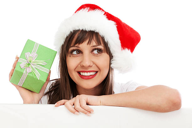 istock Young woman with santa hat and christmas gift 155146416