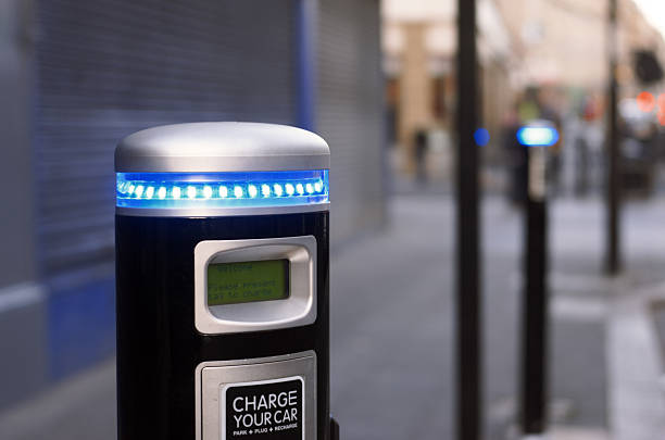 istock Electric car charging point in the street, blurred background 155146524