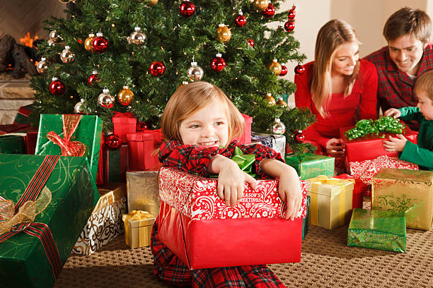 istock Little Girl Holding Christmas Gift 155146641