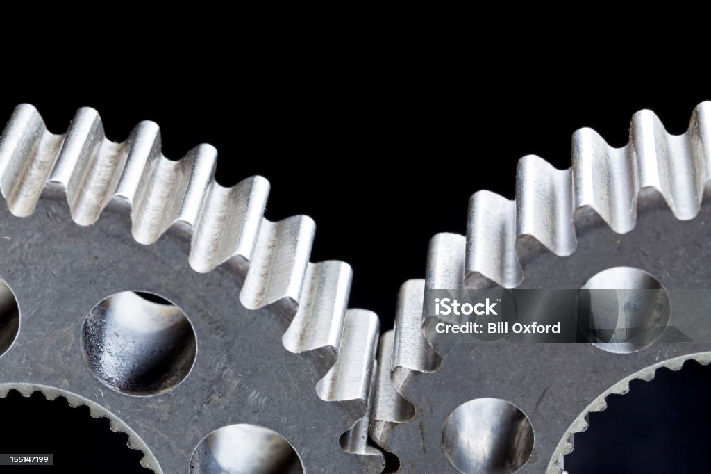 Unity. Gears. Two gears with black background meshing. Two Objects Stock Photo