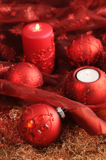 istock Christmas Ornaments and candle with on red tablecloth 155147583
