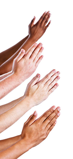 istock Four pairs of isolated hands praying against white 155147746