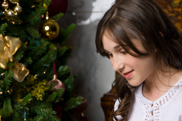 istock Young Girl Excited To Open Christmas Present 155147899