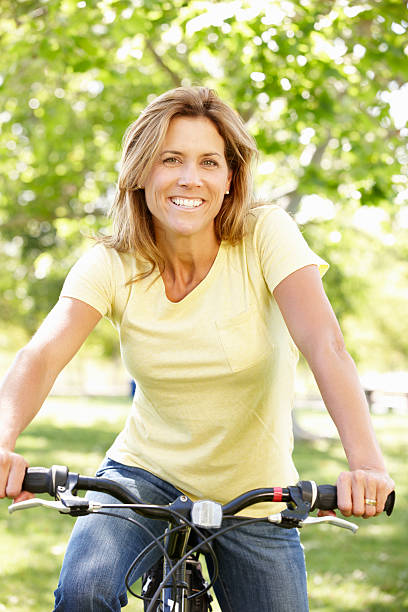 istock Woman riding bike 155147997