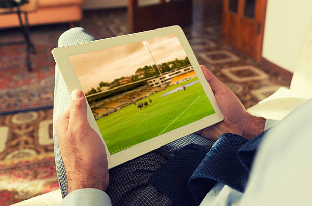istock Man watching a soccer tv game on digital tablet 155148111