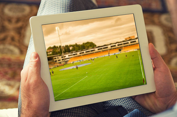 istock Man watching a soccer tv game on digital tablet 155148115