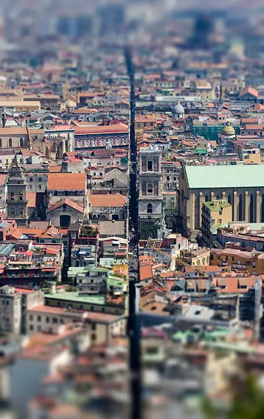 Spaccanapoli street in the center of Naples, tilt-shift image focoused on Santa Chiara Church.