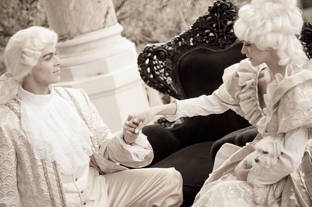 Passion in Old French Costumes Passionate man and woman kissing in traditional French costume Maria-Antonietta style. The photo was taken in Cannes during the iStockalypse. valentines day history stock pictures, royalty-free photos & images